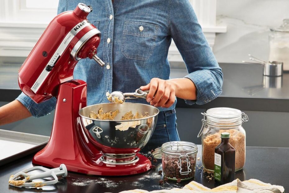 Kitchen tech tools for baking cookies, including a digital scale, mixer, and baking equipment